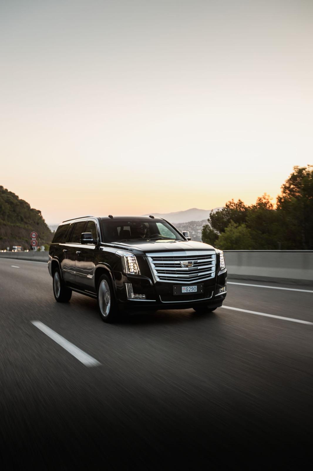 Cadillac Escalade luxury SUV with chauffeur